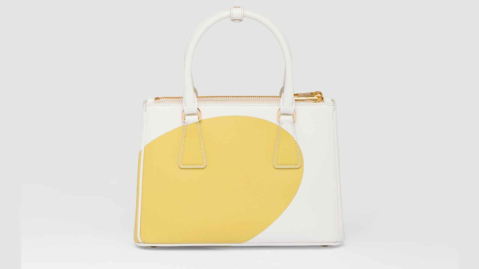  Designer Handbag: Gucci, Prada, or Chanel Bag + £10,000